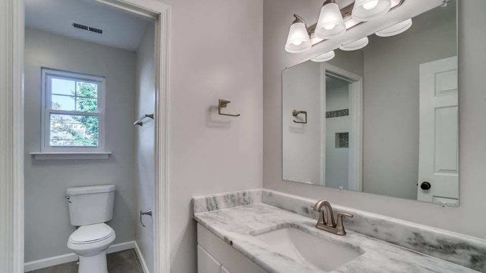Powder room with vanity and toilet