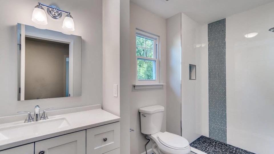 Simple bathroom with vanity and toilet