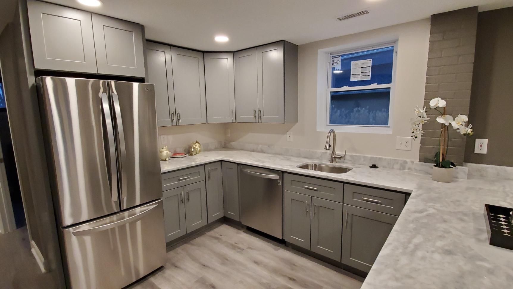 Gray kitchen with stainless appliances